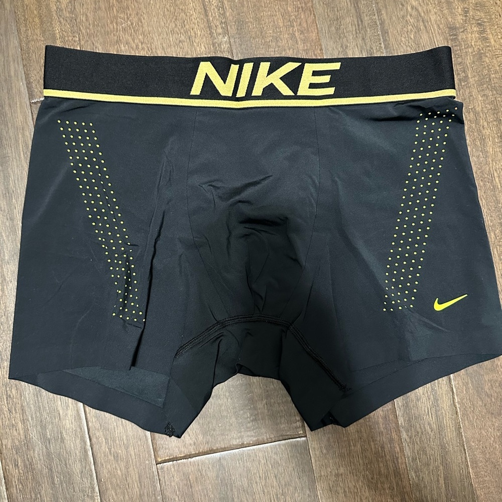 Nike trunks reflective accents.